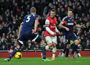Arsenal v Fulham 2013-14 Collection: Jack Wilshere (Arsenal) passes for Santi Cazorlas 1st goal under pressure from Brede Hangeland