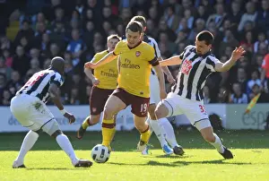 WBA V Arsenal 2010-11 Prints: Jack Wilshere (Arsenal) Paul Scharner and Youssouf Mulumbu (WBA). West Bromwich Albion 2