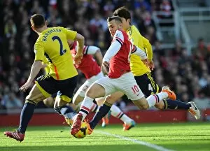 Images Dated 22nd February 2014: Jack Wilshere (Arsenal) Phil Bardsley (Sunderland). Arsenal 4: 1 Sunderland. Barclays Premier League