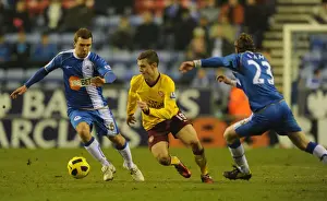 Wigan Athletic V Arsenal 2010-11 Prints: Jack Wilshere (Arsenal) Ronnie Stam and James McArthur (Wigan). Wigan Athletic 2