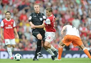Arsenal v Blackpool 2010-11 Gallery: Jack Wilshere (Arsenal) runs into referee Mike Jones. Arsenal 6: 0 Blackpool