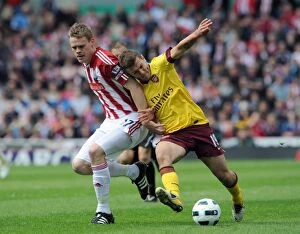Stoke City v Arsenal 2010-11 Collection: Jack Wilshere (Arsenal) Ryan Shawcross (Stoke). Stoke City 3: 1 Arsenal
