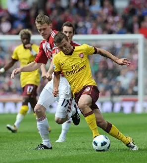 Images Dated 8th May 2011: Jack Wilshere (Arsenal) Ryan Shawcross (Stoke). Stoke City 3: 1 Arsenal