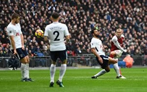 Images Dated 10th February 2018: Jack Wilshere (Arsenal) shoots under pressure from Mousa Dembele (Tottenham)