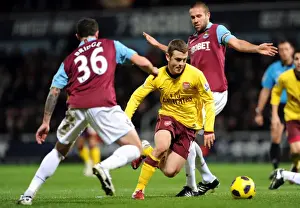 West Ham United V Arsenal 2010-11 Prints: Jack Wilshere (Arsenal) Wayne Bridge and Matthew Upson (West Ham). West Ham United 0