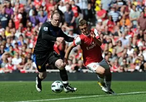 Arsenal v Manchester United 2010-2011 Collection: Jack Wilshere (Arsenal) Wayne Rooney (Man Utd). Arsenal 1: 0 Manchester United