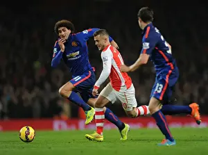 Jack Wilshere Battles Past Fellaini and McNair in Arsenal vs Manchester United Clash (2014-15)