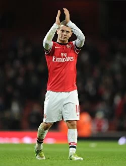 Images Dated 8th December 2012: Jack Wilshere Celebrates with Arsenal Fans after Arsenal v West Bromwich Albion Match, 2012-13