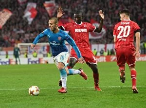 FC Koln v Arsenal 2017-18 Collection: Jack Wilshere Clashes with Guirassy and Ozcan in Arsenal's Europa League Battle against FC Koln