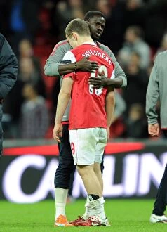 Images Dated 27th February 2011: Jack Wilshere Consoled by Emmanuel Eboue: Arsenal's Bittersweet Carling Cup Final Moment
