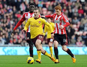 Jack Wilshere Drives Past Sunderland's Diaye and Colback