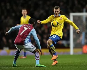 Images Dated 13th January 2014: Jack Wilshere Faces Off Against Leandro Bacuna: Aston Villa vs. Arsenal, Premier League 2013-14