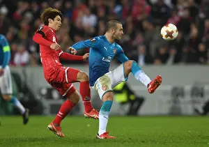 FC Koln V Arsenal 2017-18 Prints: Jack Wilshere Faces Off Against Yuya Osako in UEFA Europa League Clash