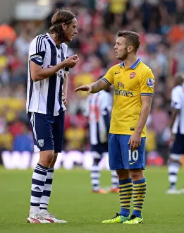 West Bromwich Albion V Arsenal 2013-14 Prints: Jack Wilshere and Jonas Olsson: A Moment of Respite Amidst the West Bromwich Albion vs