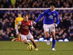 Images Dated 28th November 2012: Jack Wilshere Outmaneuvers Marouane Fellaini: Everton vs Arsenal, Premier League 2012-13