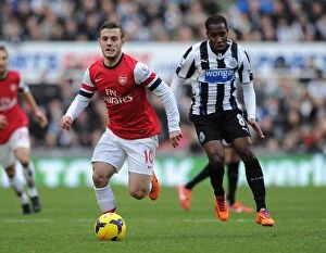 Newcastle United Collection: Jack Wilshere Outmaneuvers Moussa Sissoko: A Battle in the Midfield - Newcastle United vs Arsenal