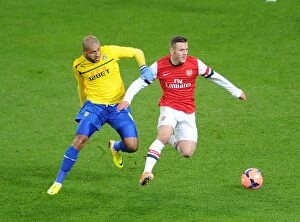 Images Dated 24th January 2014: Jack Wilshere Outpaces Leon Clarke in FA Cup Showdown: Arsenal vs. Coventry City (2013-14)