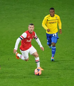 Arsenal V Coventry City - FA Cup 4th Rd 2013-14 Prints: Jack Wilshere Outruns Franck Moussa in FA Cup Clash: Arsenal vs Coventry City, 2014
