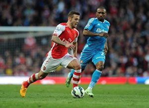 Jack Wilshere Outsmarts Jermain Defoe: Arsenal's Midfield Maestro Outmaneuvers Sunderland Rival in Thrilling 2014-15 Premier League Showdown