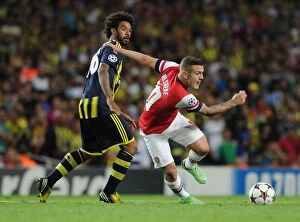 Uefa Champions Laegue Collection: Jack Wilshere Overpowers Christian: Arsenal's Champions League Battle against Fenerbahce