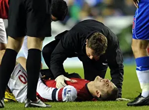 Jack Wilshere Receives Treatment from Arsenal Physio Colin Lewin during Reading vs Arsenal (2012-13)