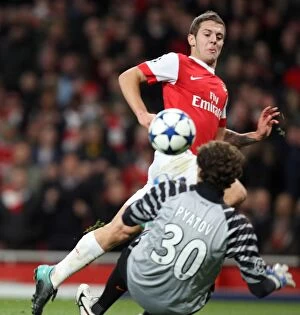 Arsenal v Shaktar Donetsk 2010 - 11 Collection: Jack Wilshere scores Arsenals 4th goal past Andriy Pyatov (Shaktar)
