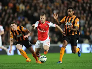 Hull City V Arsenal 2014/15 Prints: Jack Wilshere Slices Through Hull's Defense: Arsenal's Midfield Maestro Shines in Premier League Showdown