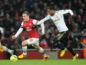 Arsenal V Swansea - FA Cup 3rd Rd Replay 2012-13 Prints: Jack Wilshere Surges Past Kemy Agustien in FA Cup Third Round Replay: Arsenal vs Swansea City
