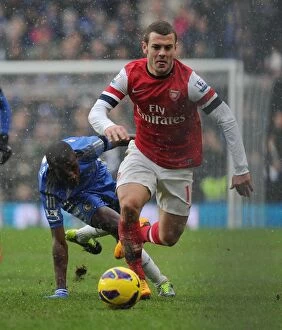 Images Dated 20th January 2013: Jack Wilshere Surges Past Ramires: Intense Rivalry in Chelsea vs. Arsenal Premier League Clash