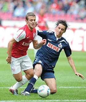 Cologne v Arsenal Collection: Jack Wilshere Takes on Pedro Geromel: Cologne vs. Arsenal Pre-Season Clash