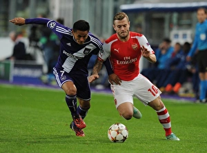 Jack Wilshere vs. Andy Najar: Midfield Battle in Arsenal's UEFA Champions League Clash with RSC Anderlecht (2014)