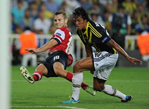 Fenerbahce V Arsenal 2013-14 Prints: Jack Wilshere vs Bruno Alves: Battle in Istanbul - Arsenal's Champions League Play-offs Clash with Fenerbahce