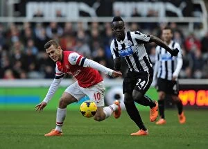 Newcastle United Collection: Jack Wilshere vs. Cheick Tiote: Battle in the Midfield - Newcastle United vs. Arsenal (2013-14)