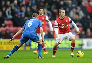 Jack Wilshere vs. David Jones: Intense Battle in Wigan Athletic vs. Arsenal (2012-13 Premier League)