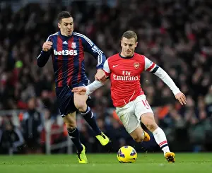 Arsenal V Stoke City 2012-13 Prints: Jack Wilshere vs Geoff Cameron: Intense Battle at Arsenal v Stoke City