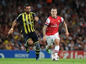 Uefa Champions Laegue Collection: Jack Wilshere vs. Gokhan Gonul: Battle in the Arsenal v Fenerbahce UEFA Champions League Clash
