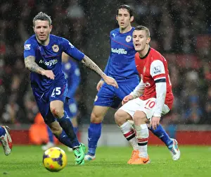 Arsenal V Cardiff City 2013-14 Prints: Jack Wilshere vs. Kevin McNaughton: Intense Battle at Arsenal vs. Cardiff City (2013-14)