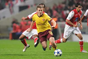SC Braga V Arsenal 2010-11 Prints: Jack Wilshere vs. Leandro Salino: Arsenal's Struggle Against Braga in UEFA Champions League