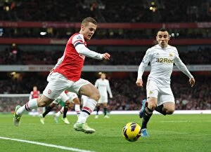 Arsenal v Swansea 2012-13 Collection: Jack Wilshere vs. Leon Britton: Battle for Ball Control - Arsenal v Swansea City