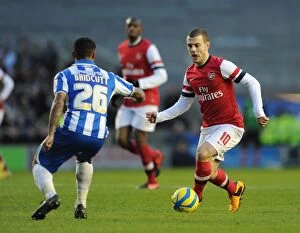 Images Dated 26th January 2013: Jack Wilshere vs. Liam Bridcutt: Battle in the FA Cup Fourth Round between Brighton & Hove Albion