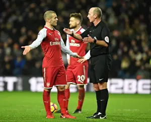 West Bromwich Albion V Arsenal 2017-18 Prints: Jack Wilshere vs Mike Dean: Heated Confrontation during Arsenal's Match at West Bromwich Albion