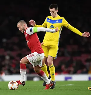 Arsenal V BATE Borisov 2017-18 Prints: Jack Wilshere vs Mirko Ivanic: Battle in the Europa League - Arsenal v BATE Borisov