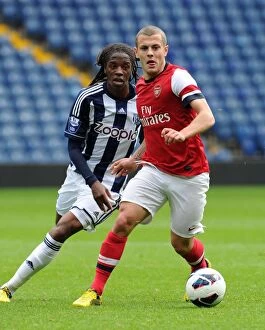 Images Dated 1st October 2012: Jack Wilshere vs. Romaine Sawyers: Clash of the Young Stars in Arsenal U21 vs