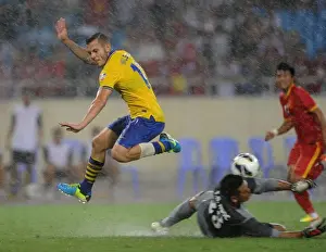 Vietnam V Arsenal 2013-14 Prints: Jack Wilshere vs. Tran Buu Ngoc: A Talent-Filled Clash in the Vietnam vs