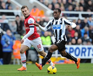 Newcastle United V Arsenal 2013-14 Prints: Jack Wilshere vs. Vernon Anita: Intense Battle at St