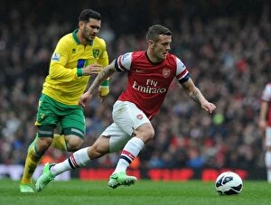 Images Dated 13th April 2013: Jack Wilshere's Agile Moves: Outmaneuvering Norwich's Bradley Johnson in the 2012-13 Arsenal Victory