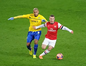 Arsenal V Coventry City - FA Cup 4th Rd 2013-14 Prints: Jack Wilshere's Blazing Speed: Outpacing Leon Clarke in Arsenal's FA Cup Victory