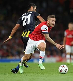 Uefa Champions Laegue Collection: Jack Wilshere's Dominant Moment: Arsenal's Champions League Victory over Selcuk Sahin (2013)