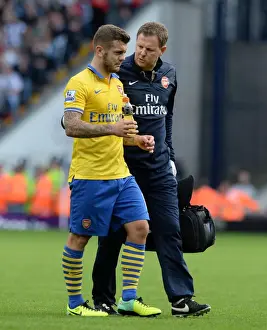 West Bromwich Albion V Arsenal 2013-14 Prints: Jack Wilshere's Injury Treatment: Arsenal's Colin Lewin at West Bromwich Albion