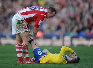 Stoke City V Arsenal 2013-14 Prints: Jack Wilshere's Injury Woes: Charlie Adam Consoles the Arsenal Star During Stoke vs Arsenal Match (2013-14)